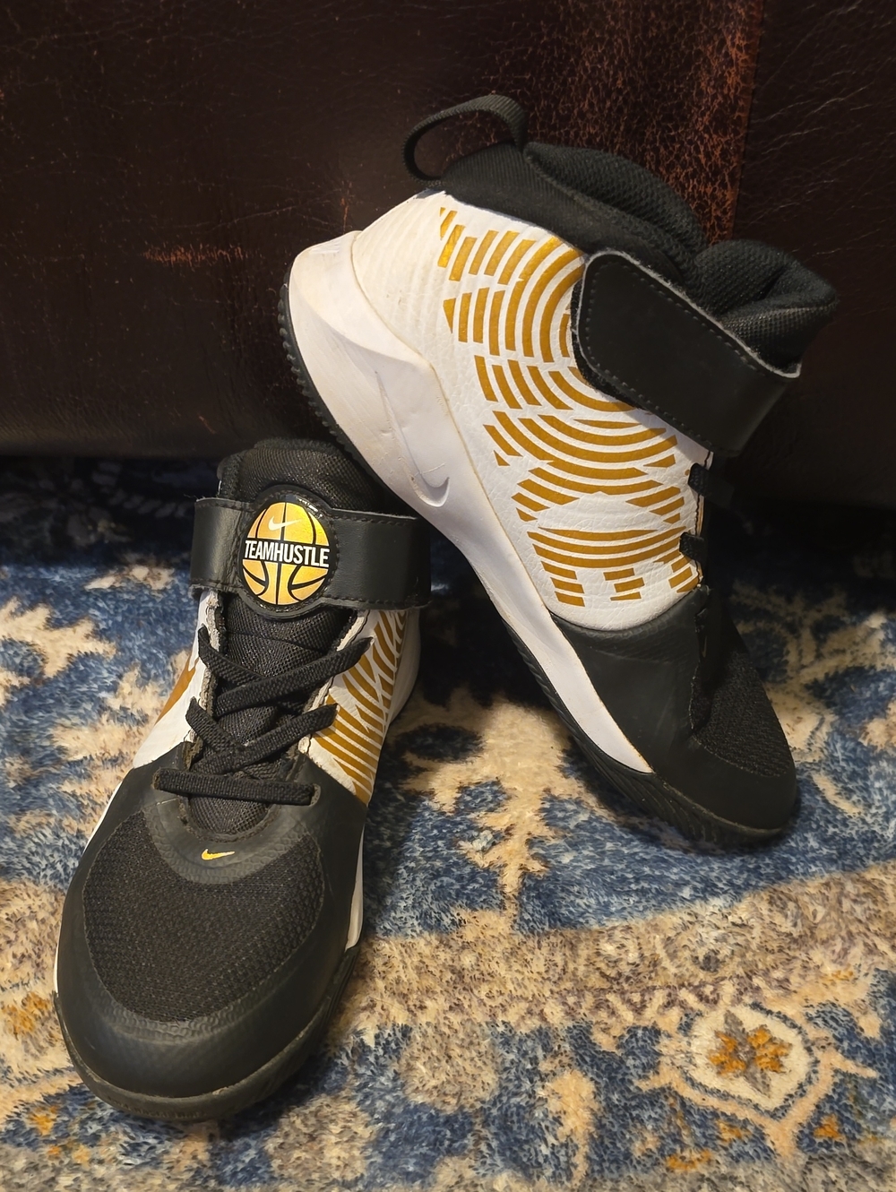 Nike Kids Black and Gold Team Hustle Mid-Top Sneakers